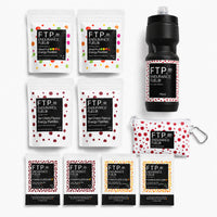 Long Session Stack contents with two Power Fluids Mix Tart Cherry and two Core Neutral Citrus taster sachets, energy pastilles, matte black 710ml bottle and Adventure Pouch