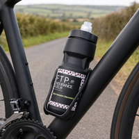 FTP black 710ml sports bottle in a bottle cage on a road bike